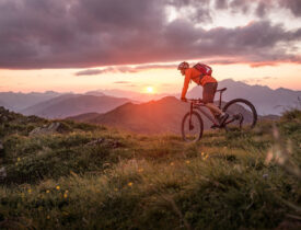 Male mountainbiker at sunset in the mountains