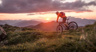 Male mountainbiker at sunset in the mountains