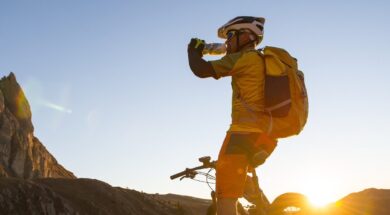 Mountain bike athletes drinking energy drink