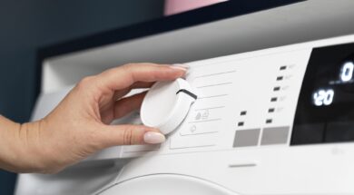 woman-choosing-program-washing-machine